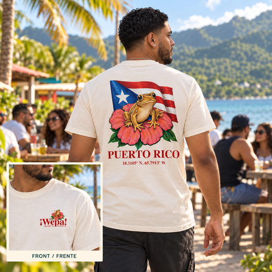 AI-generated ¡Wepa! T-shirt back reveal in a Luquillo beachside setting with a corner view of the front left-chest design; official Ninja POD mockups show exact print placement.